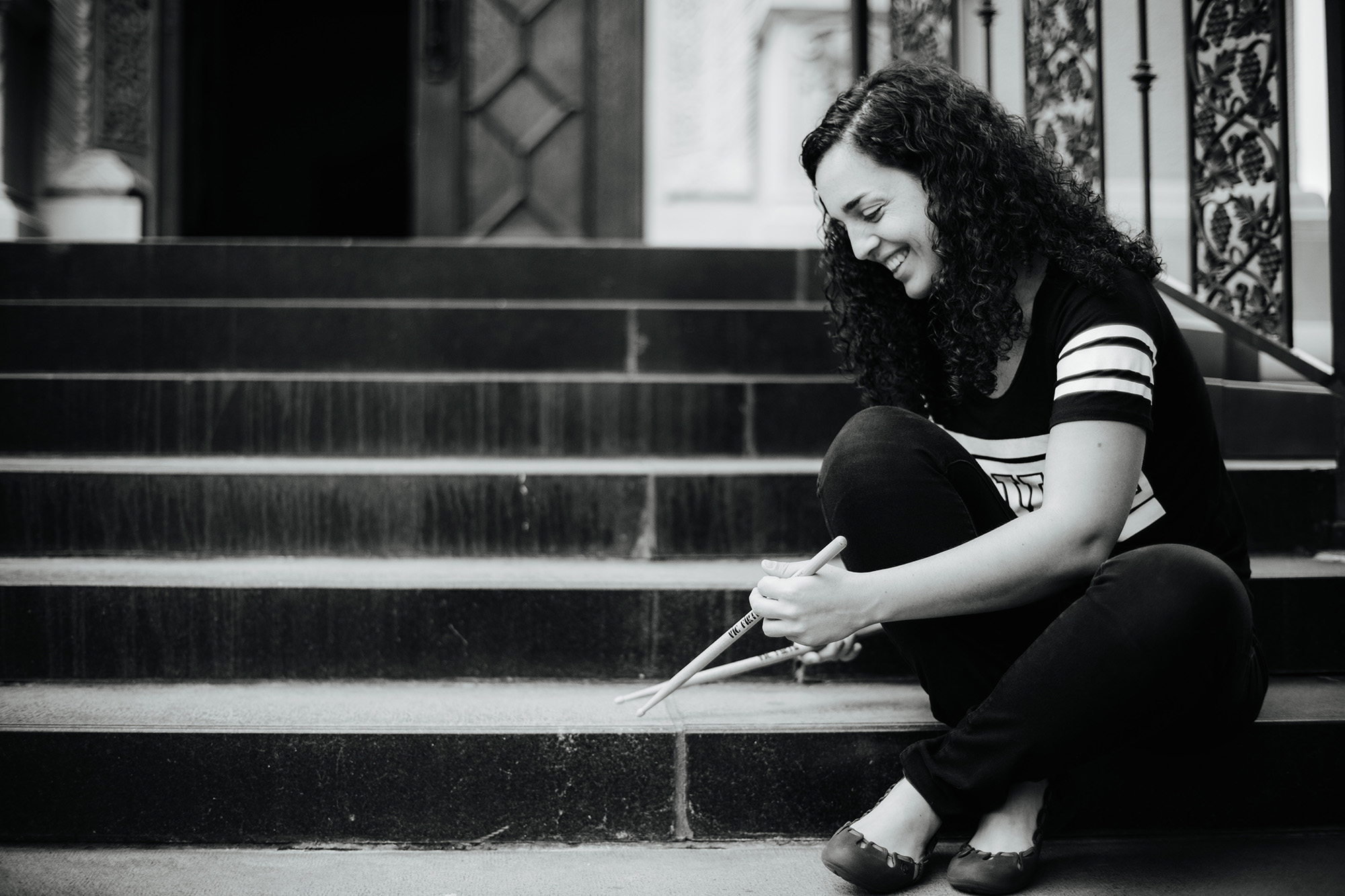 Ana Barreiro playing on a step with her drum sticks